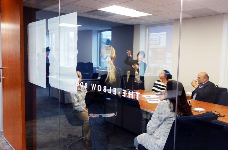 Faculty and Staff brainstorm in a conference room during Corner CON 2018